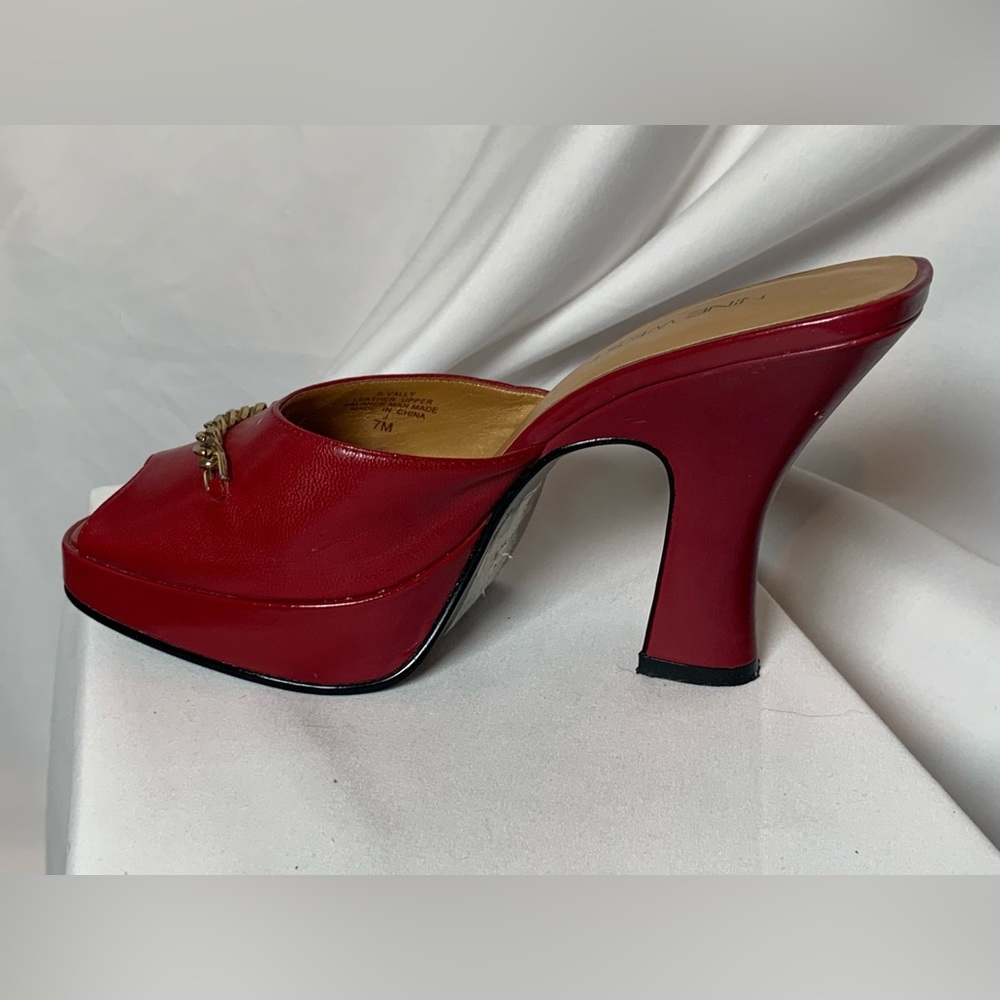Nine West peep toe mule 4” heel, size 7 1/2. Moderate wear.